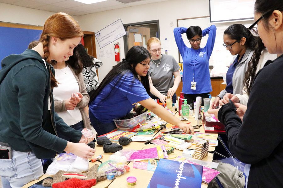 CIA members create gift boxes for children in Mexico.