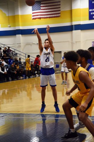 Senior John Silverio plays at basketball again against North Garland.