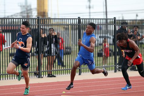 Junior Garnett Burke competes in a relay race.