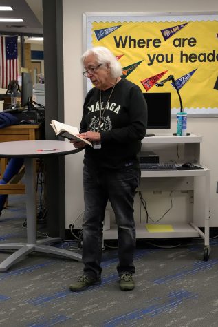 Mark Lee reads a poem during the literary festival.